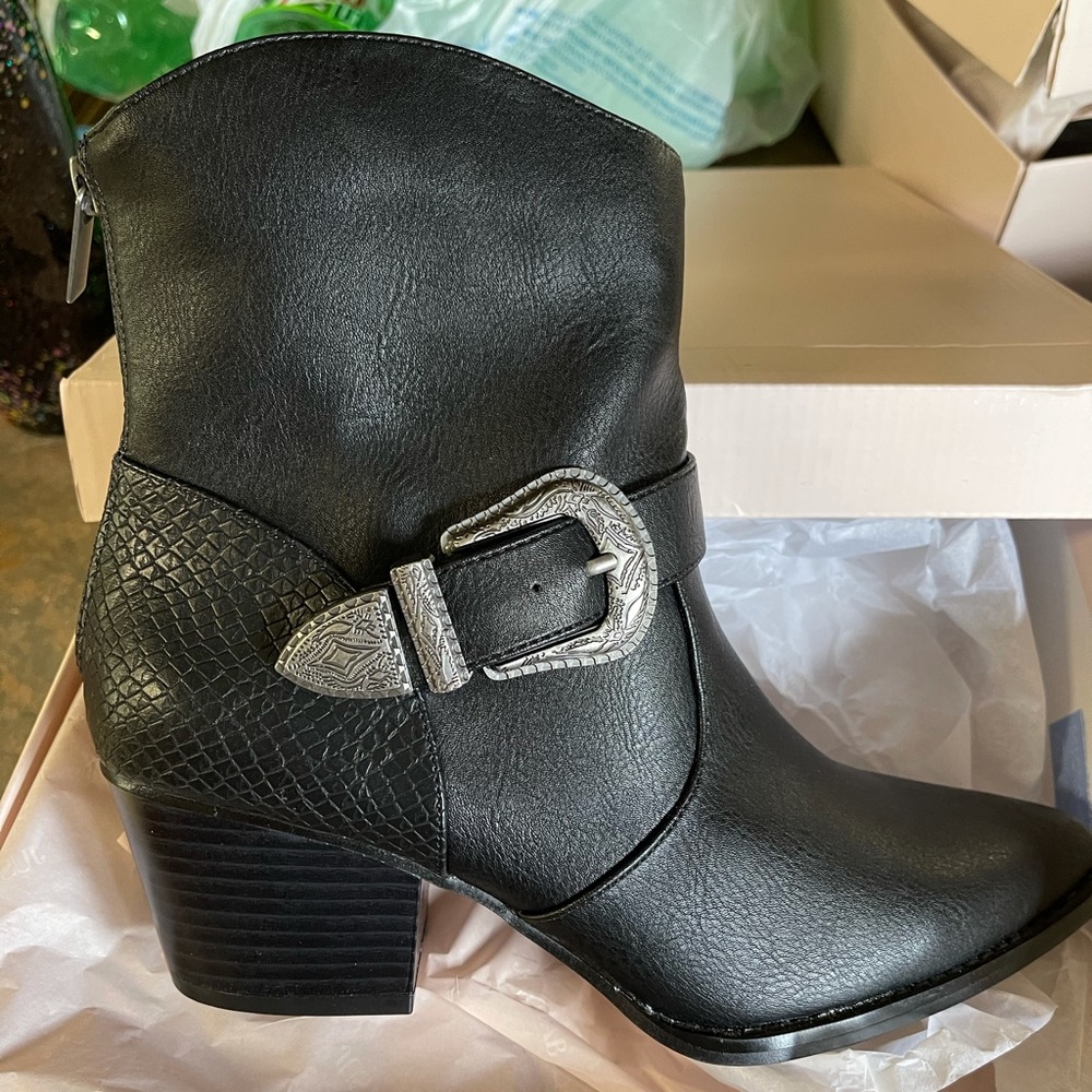 Size 8.5 new in box black boots.